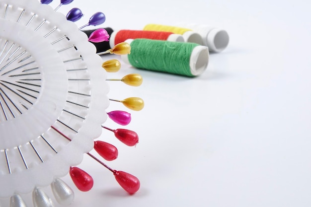 close up of colorful embroidery threads and needle